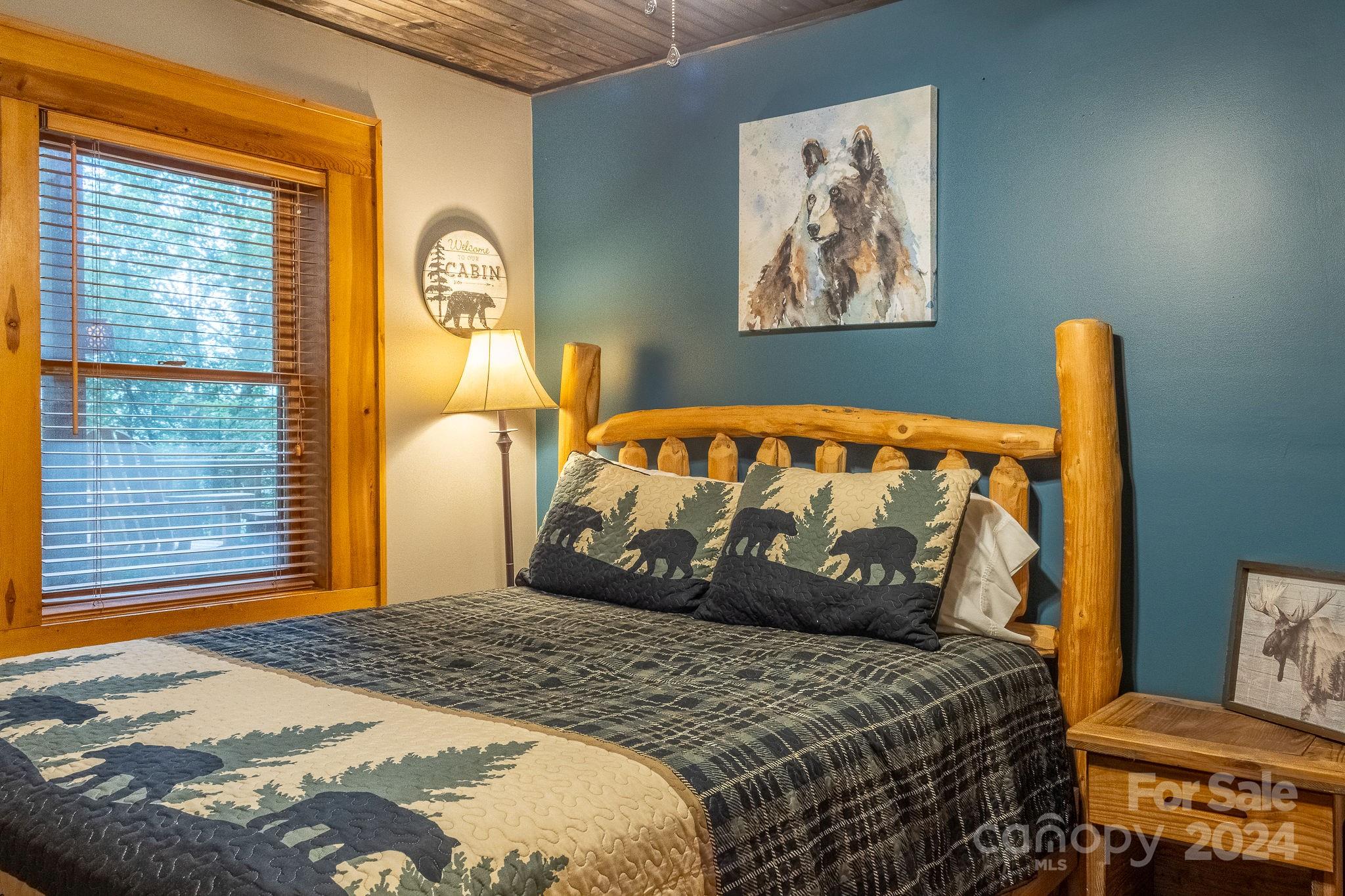 274 Hemlock Road Banner Elk, NC 28604 - Photo 35 of 46 a bedroom with a bed and window