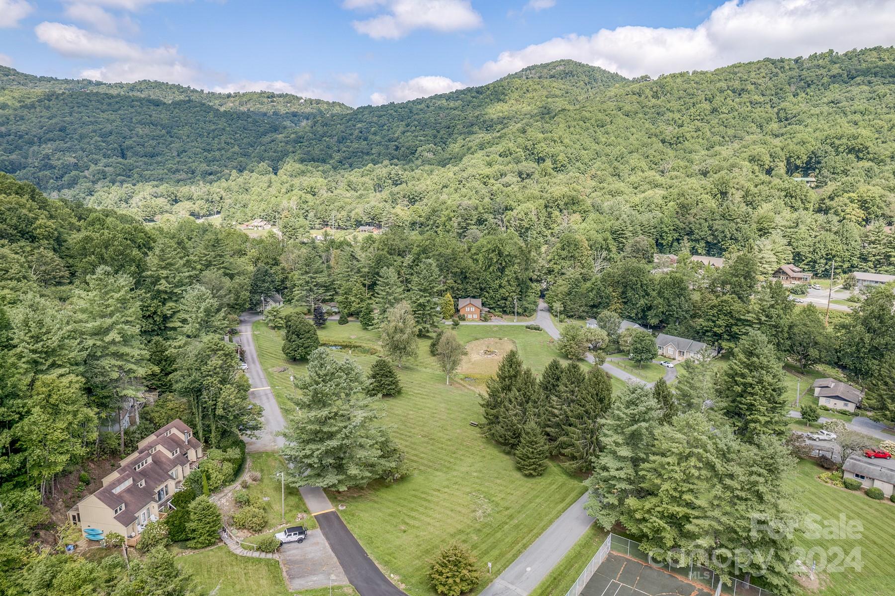 274 Hemlock Road Banner Elk, NC 28604 - Photo 46 of 46 a view of a lake with a mountain in the background