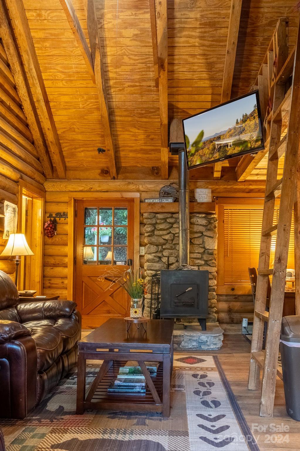 274 Hemlock Road Banner Elk, NC 28604 - Photo 5 of 46 a front view of a house with many windows