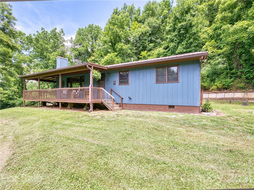 685 Osborne Road Clyde, NC 28721 - Photo 1 of 30 a house with trees in the background