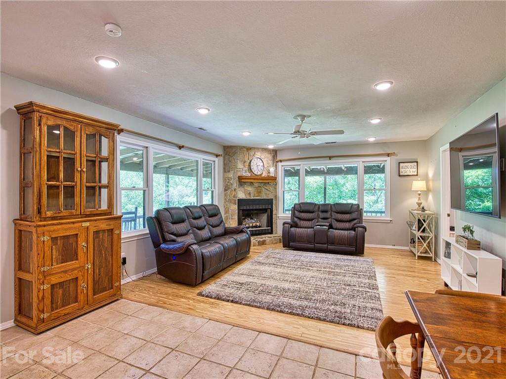 685 Osborne Road Clyde, NC 28721 - Photo 14 of 30 a living room with furniture and a flat screen tv