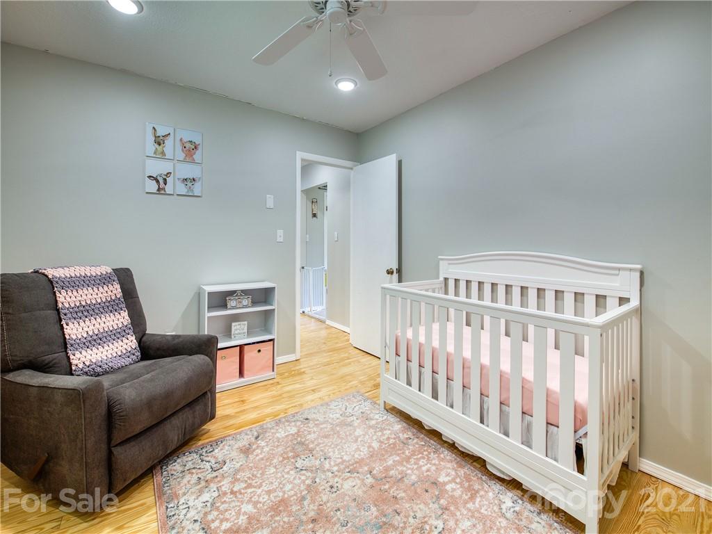 685 Osborne Road Clyde, NC 28721 - Photo 26 of 30 a living room with furniture and wooden floor
