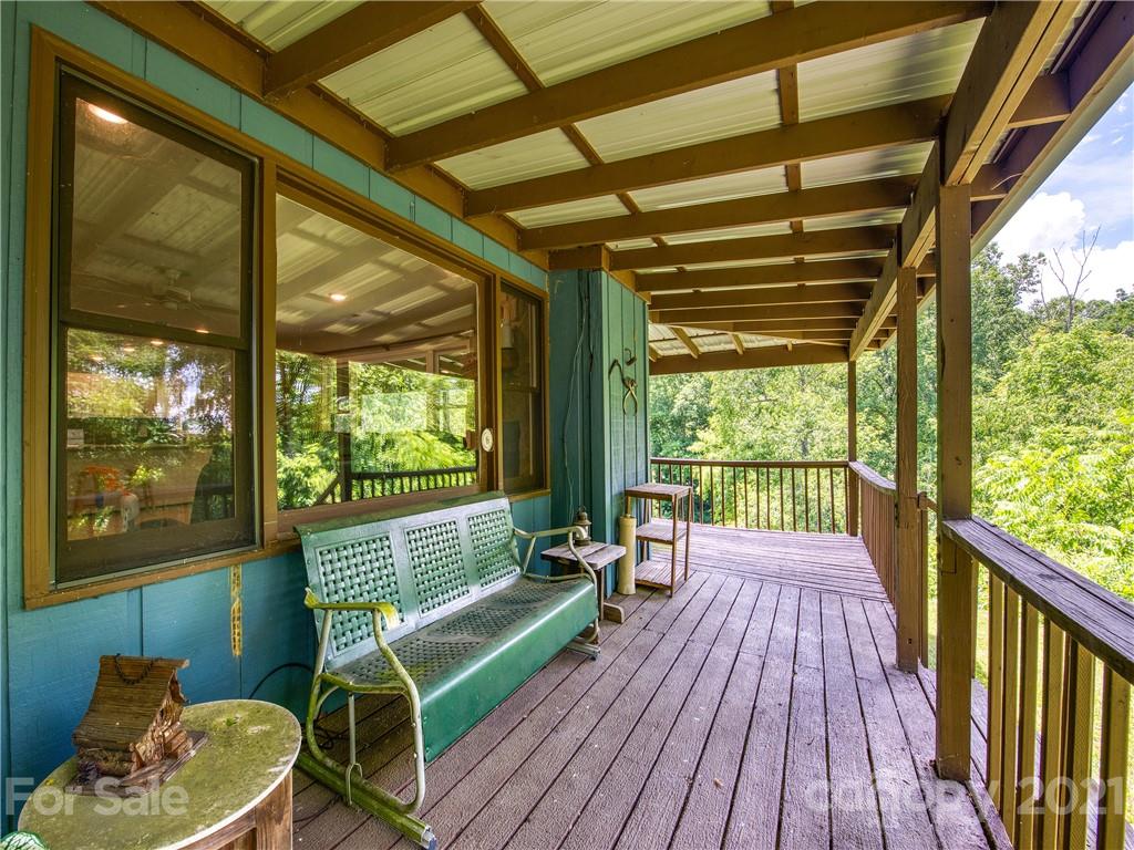 685 Osborne Road Clyde, NC 28721 - Photo 5 of 30 a view of two chairs in the balcony
