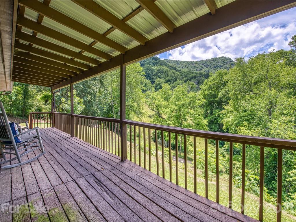 685 Osborne Road Clyde, NC 28721 - Photo 6 of 30 a view of balcony with wooden floor