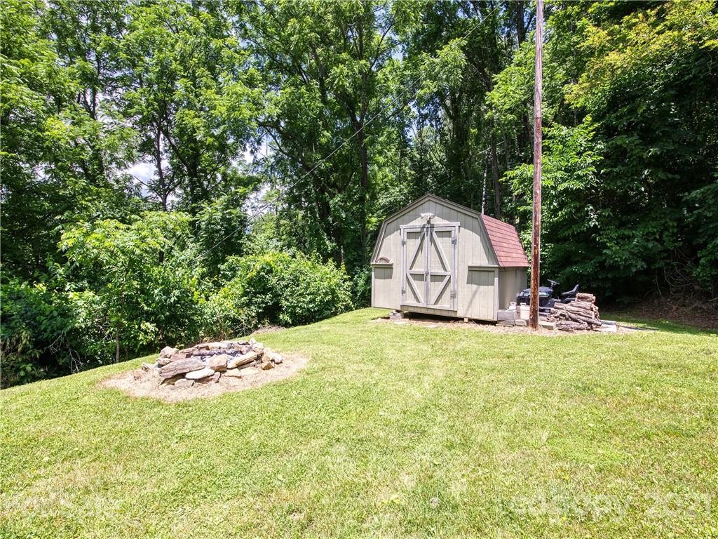 685 Osborne Road Clyde, NC 28721 - Photo 9 of 30 a garden view with a backyard space