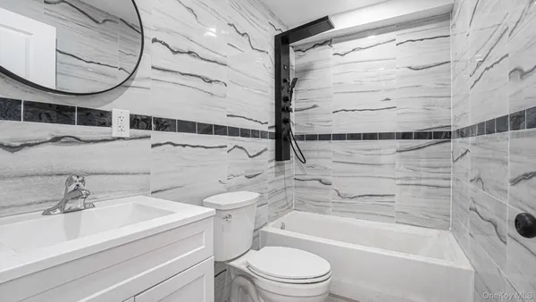 a bathroom with a sink a toilet and a bathtub