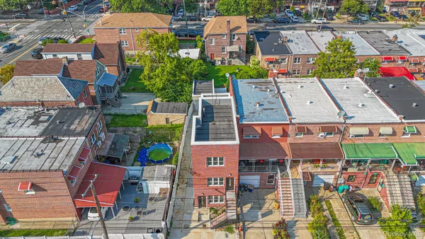 an aerial view of houses with yard