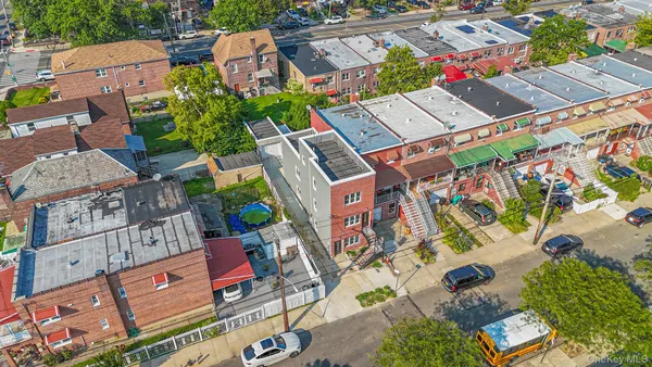 an aerial view of a house with a yard