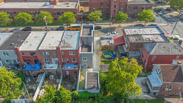 an aerial view of a houses with outdoor space