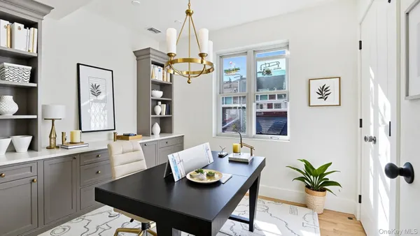 a view of a dining room with furniture and window