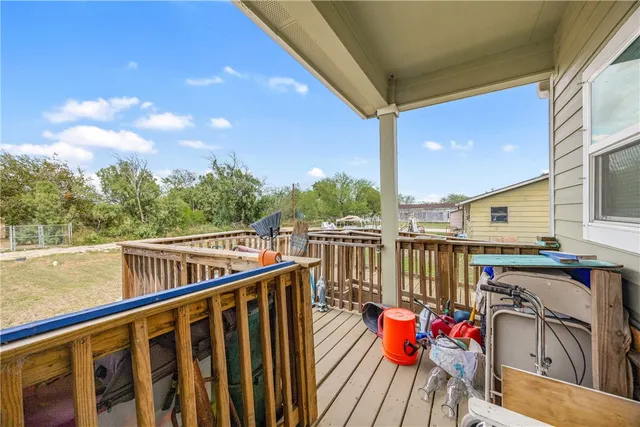 a white toilet sitting next to a shower curtain