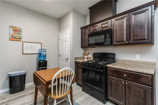 a kitchen with a sink and a window