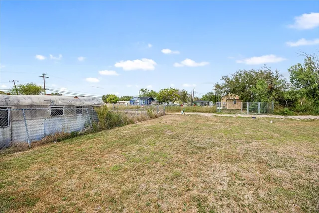 a view of a field with trees