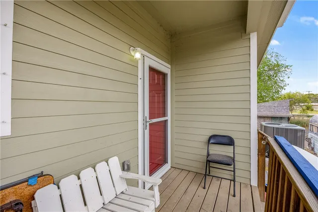 a view of balcony with furniture
