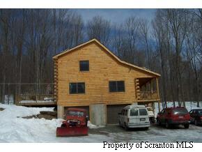 0 Millbrook Road Waymart, PA 18436 - Photo 2 of 5 a front view of a house with cars parked
