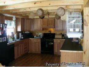 0 Millbrook Road Waymart, PA 18436 - Photo 5 of 5 a kitchen with cabinets and appliances