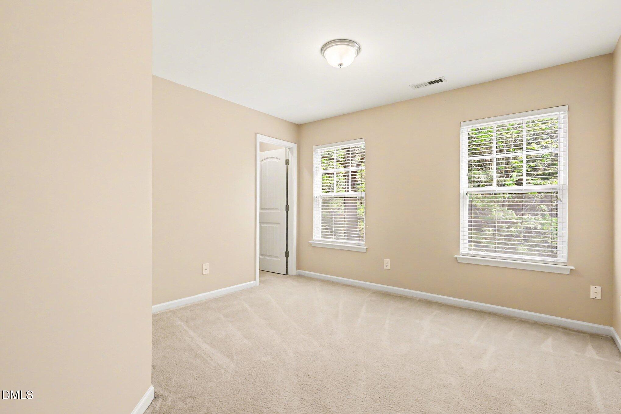 2409 Memory Ridge Drive Raleigh, NC 27606 - Photo 22 of 36 a view of an empty room with a window