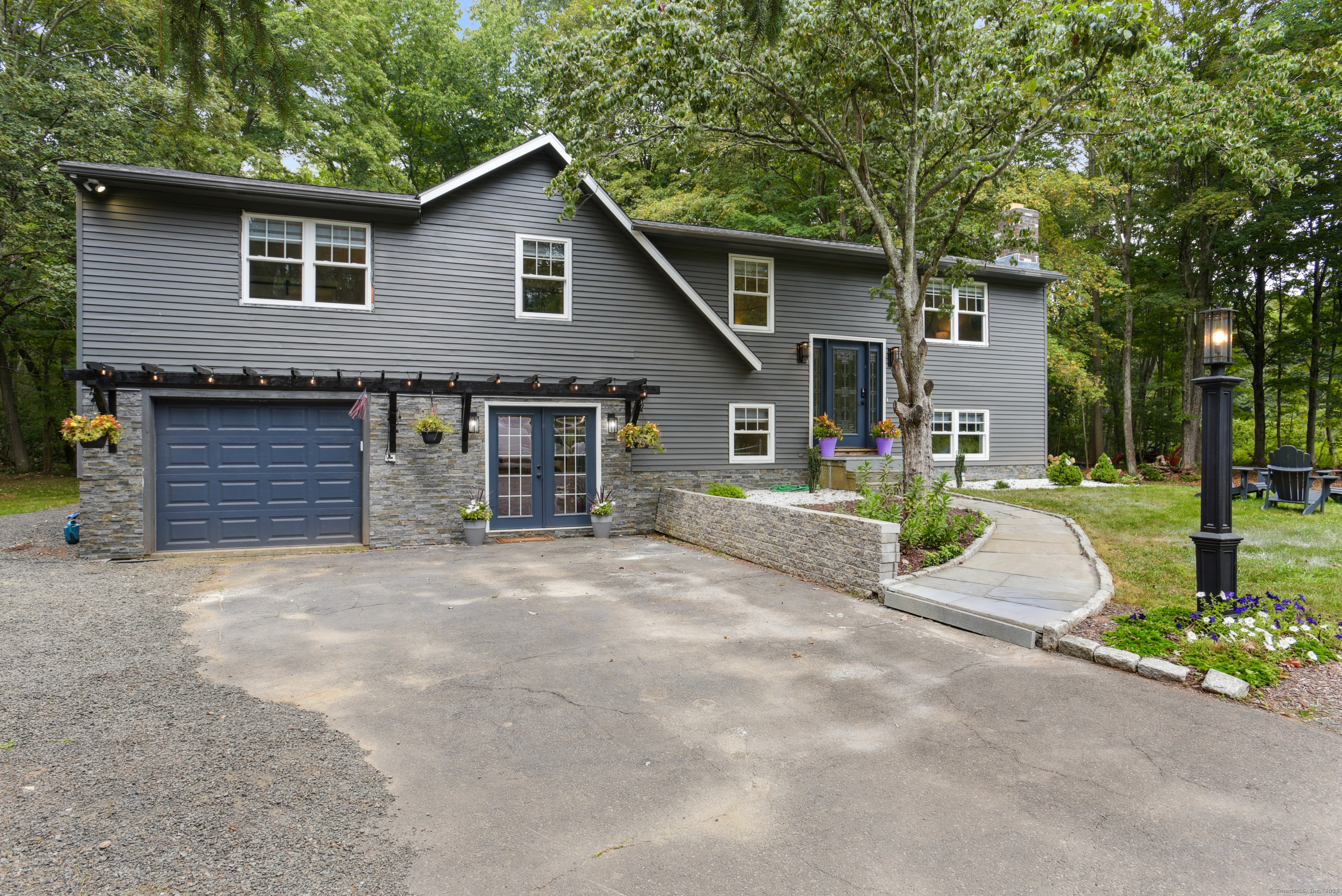 a front view of a house with a yard and garage