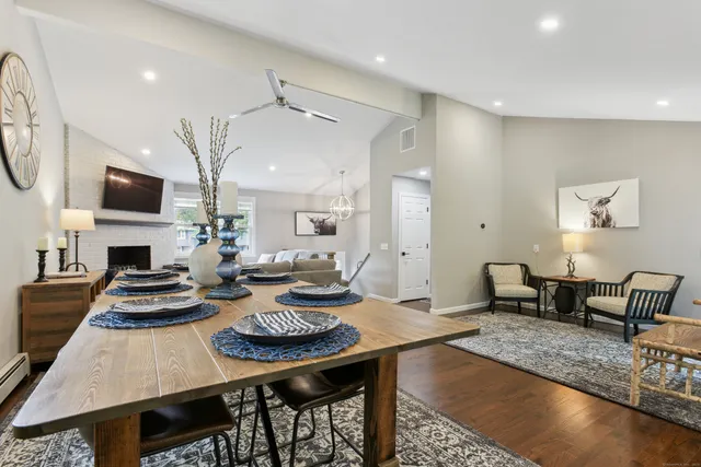 a living room with fireplace furniture and a flat screen tv