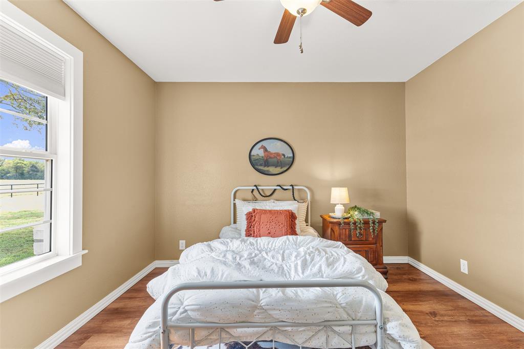 583 County Rd NW 1010 Road Northwest Mount Vernon, TX 75457 - Photo 18 of 40 a bedroom with a bed and a window