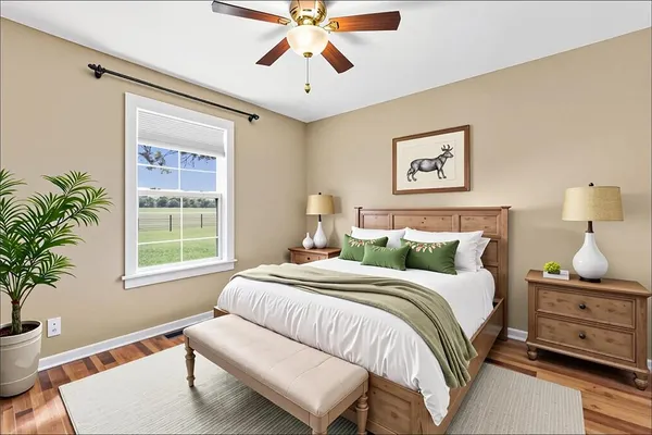 a bedroom with a bed and a window