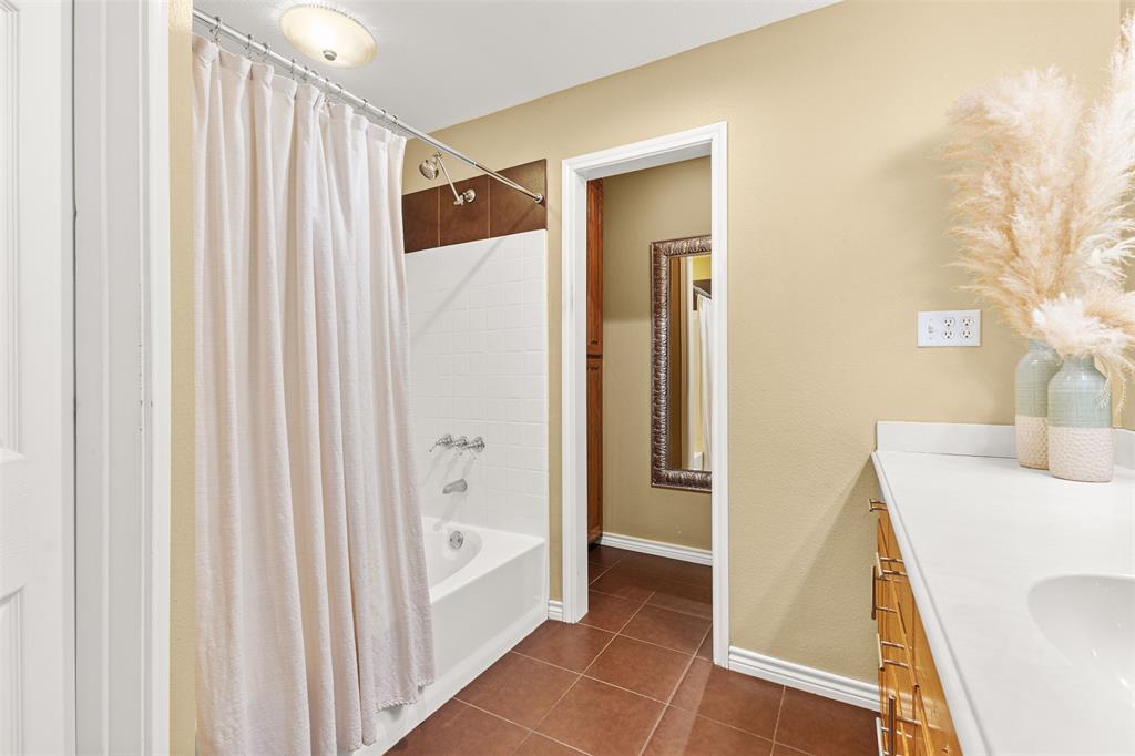 583 County Rd NW 1010 Road Northwest Mount Vernon, TX 75457 - Photo 22 of 40 a bathroom with a sink a mirror and a shower