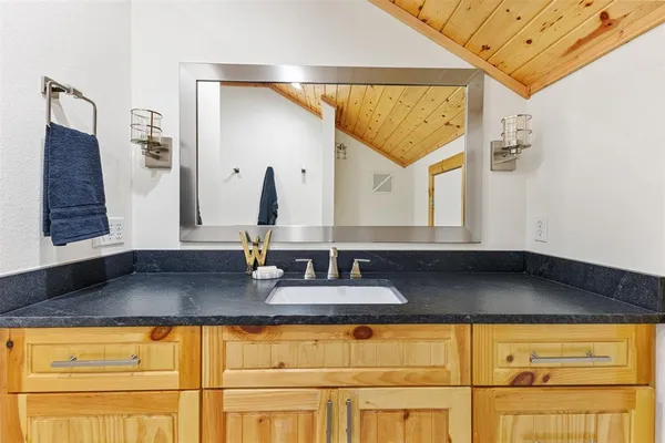 a kitchen with a sink and a refrigerator