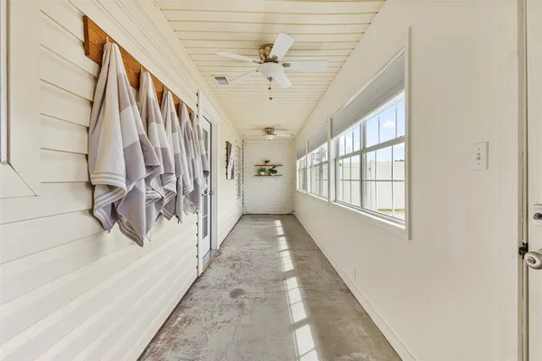 a view of entryway and hall with a window