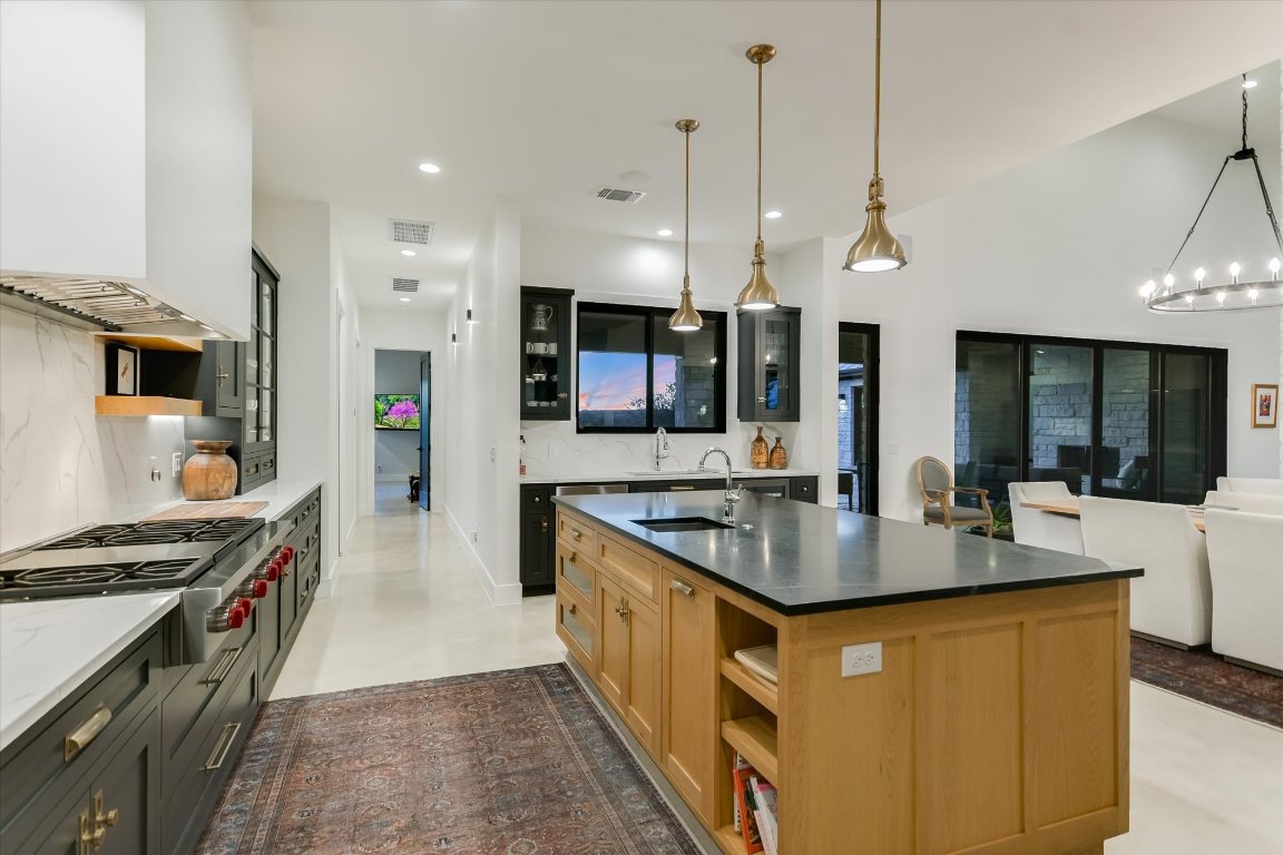343 Pug Rippy Dripping Springs, TX 78620 - Photo 16 of 40 Restaurant Grade Cooktop, massive Soapstone Center Island