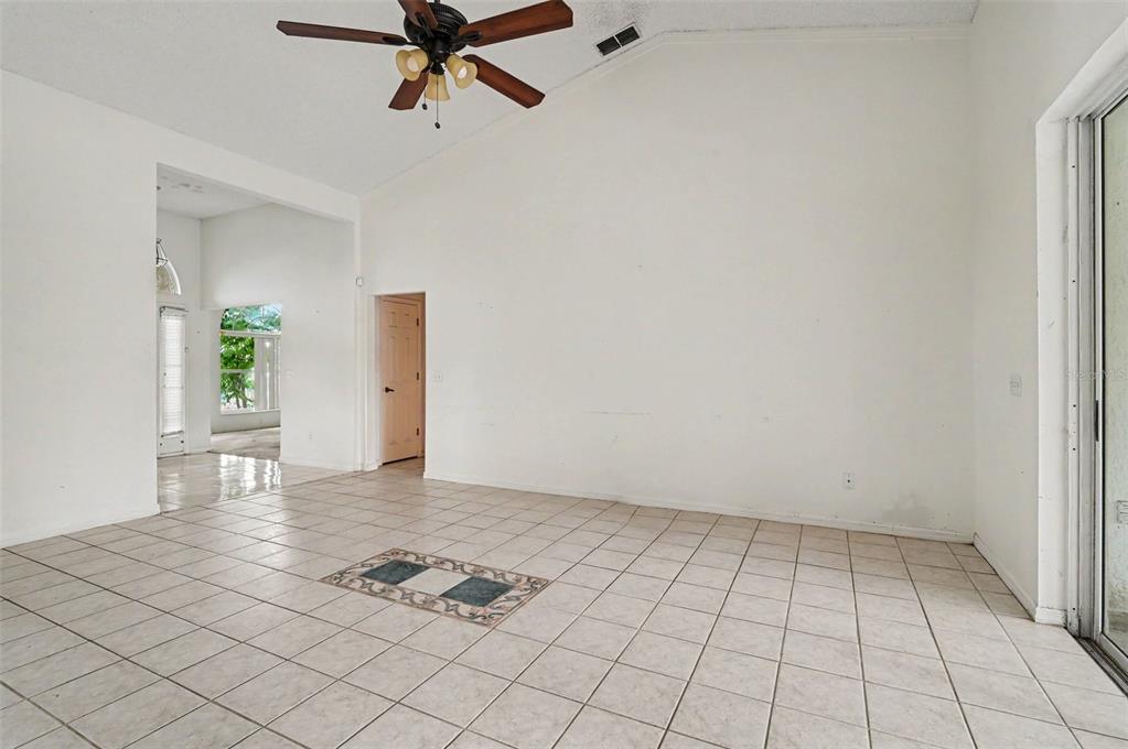 4716 Spaniel Street Orlando, FL 32818 - Photo 4 of 27 a view of an empty room and window