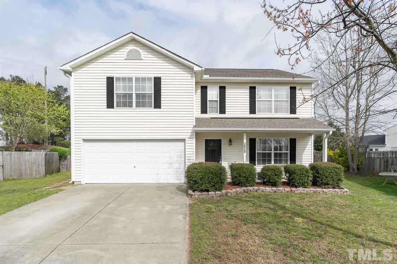 3820 Watkins Ridge Court Raleigh, NC 27616 - Photo 1 of 22 a front view of a house with a yard and garage