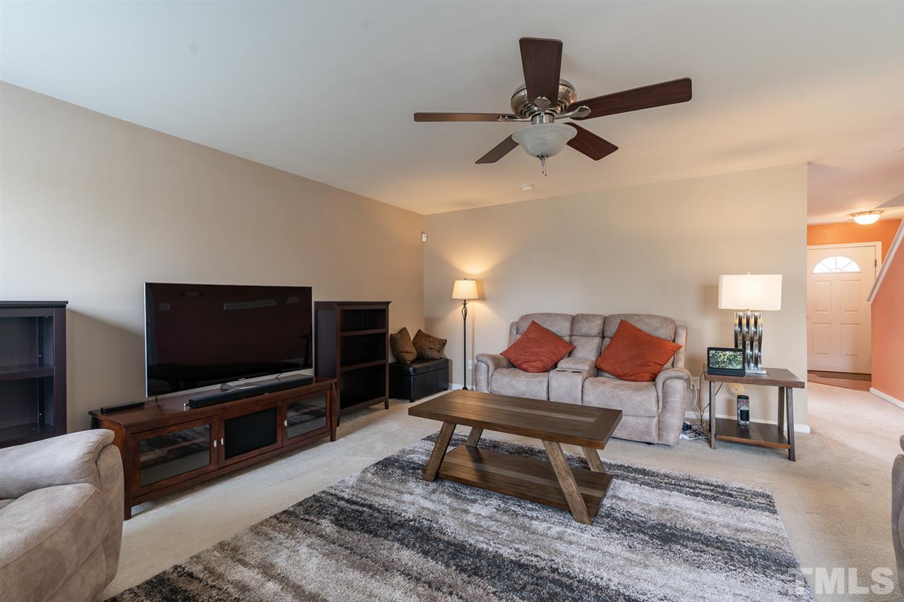 3820 Watkins Ridge Court Raleigh, NC 27616 - Photo 2 of 22 a living room with furniture and a flat screen tv