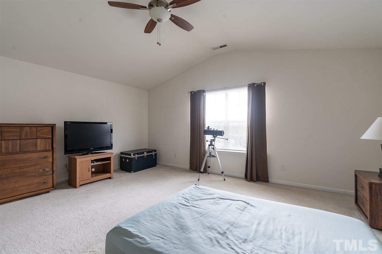 3820 Watkins Ridge Court Raleigh, NC 27616 - Photo 11 of 22 a view of a livingroom with furniture and a flat screen tv