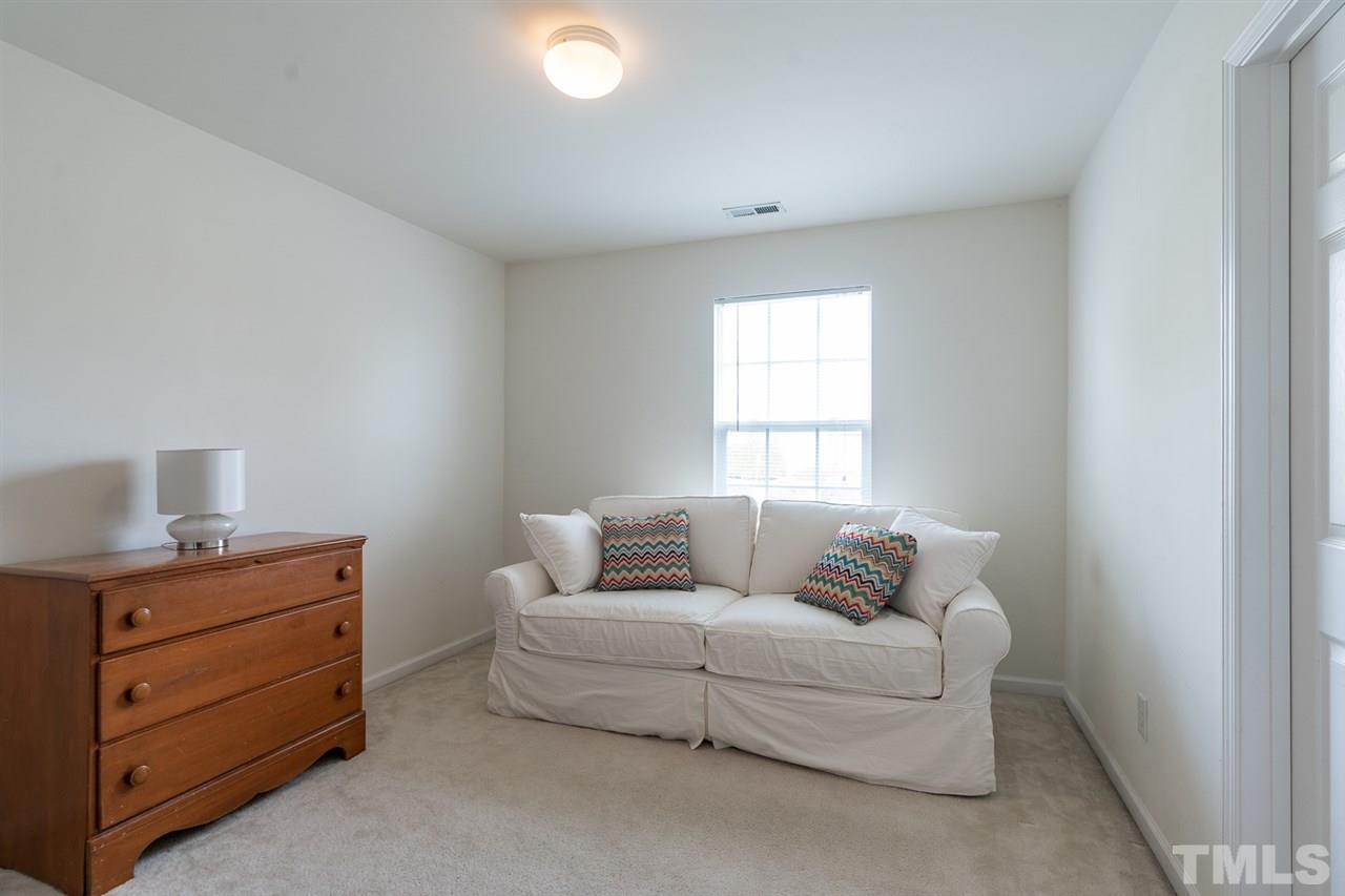 3820 Watkins Ridge Court Raleigh, NC 27616 - Photo 14 of 22 a living room with furniture and a window