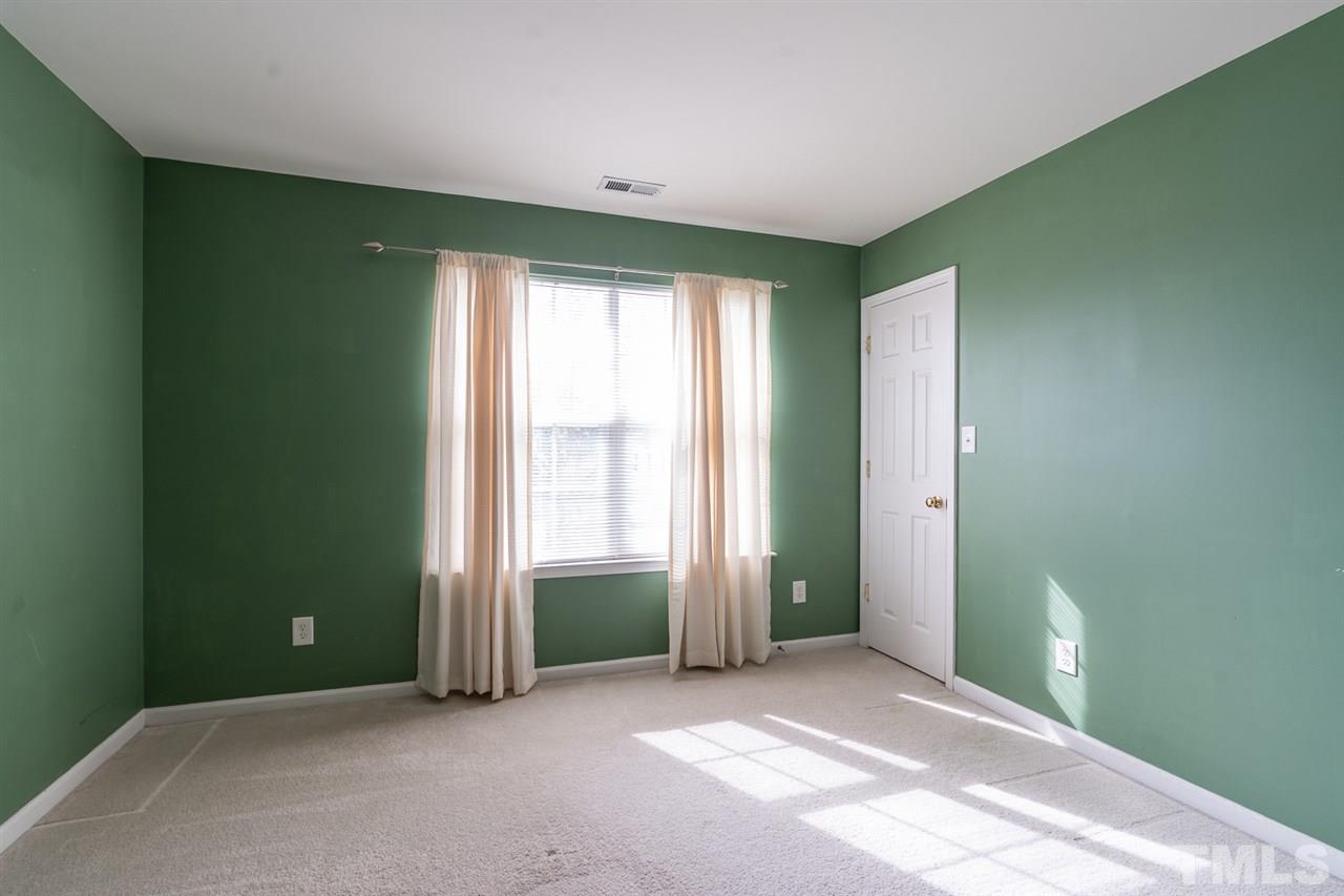 3820 Watkins Ridge Court Raleigh, NC 27616 - Photo 17 of 22 an empty room with windows and closet