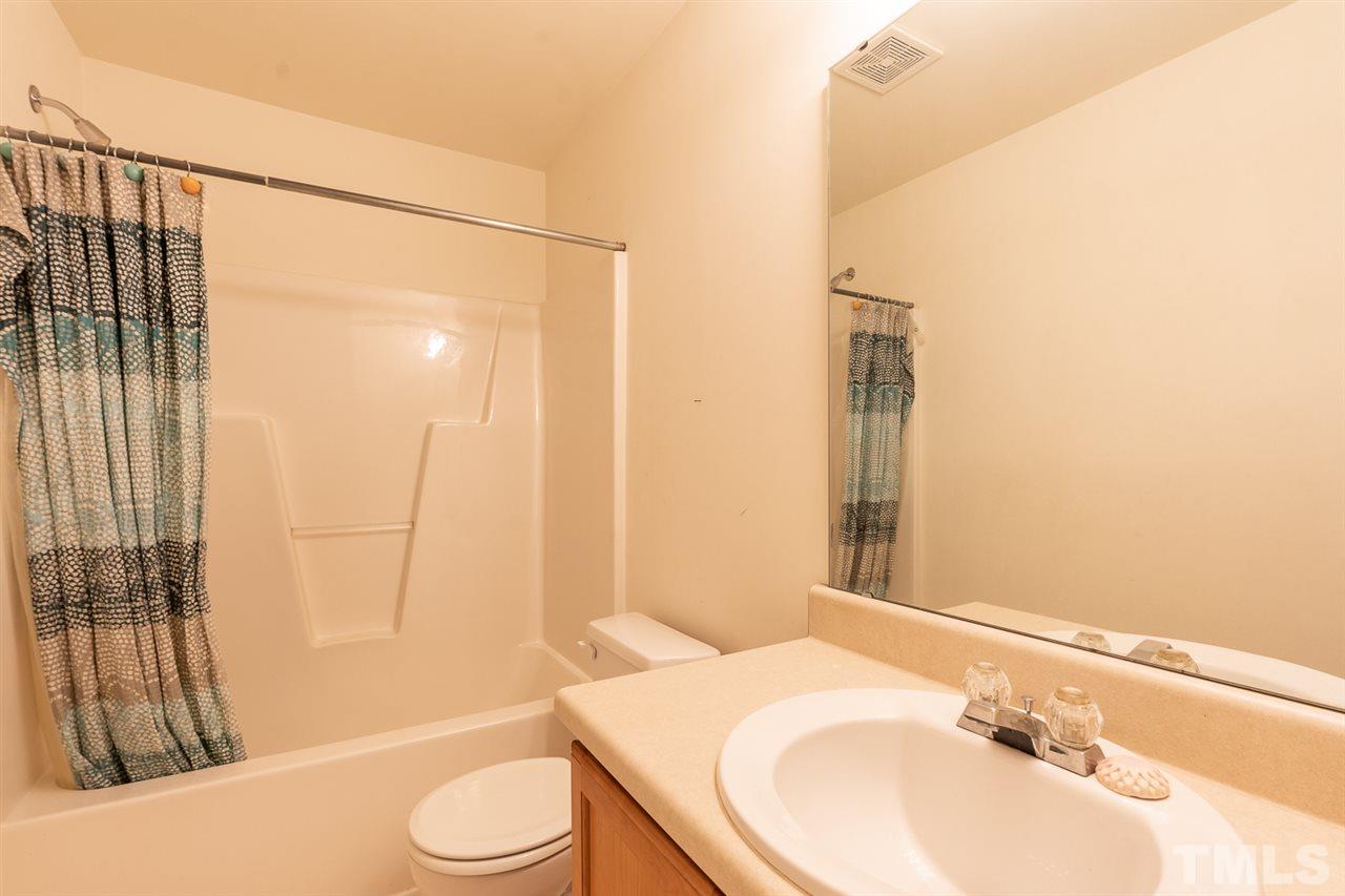 3820 Watkins Ridge Court Raleigh, NC 27616 - Photo 18 of 22 a bathroom with a sink toilet and shower