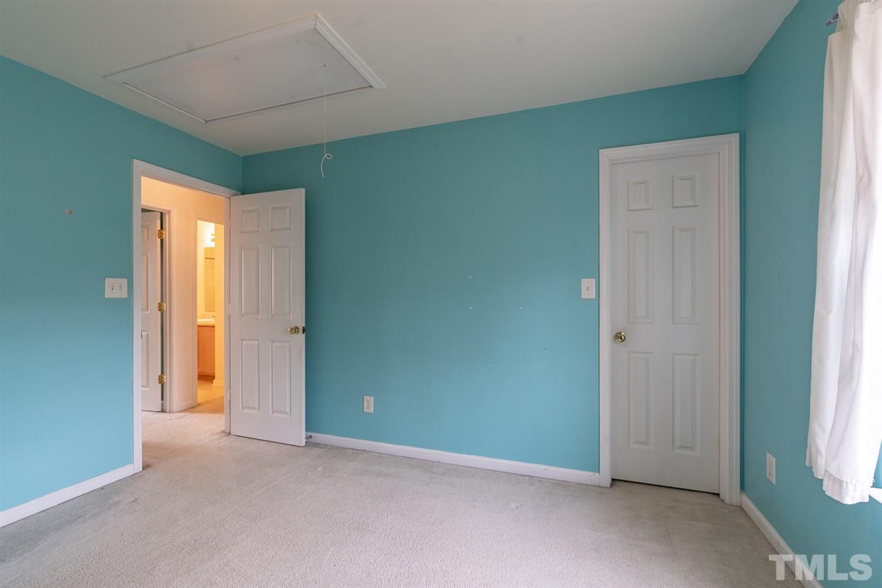 3820 Watkins Ridge Court Raleigh, NC 27616 - Photo 19 of 22 an empty room with windows and closet
