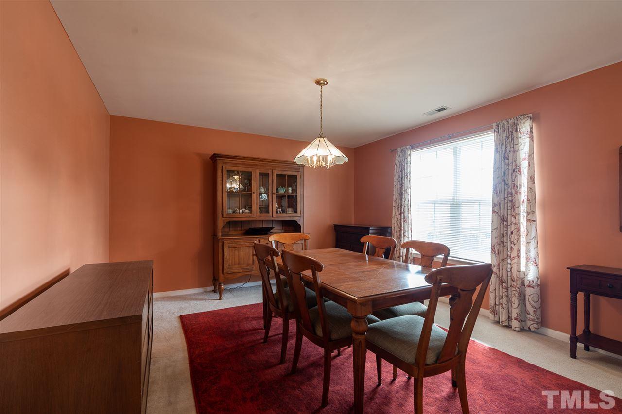 3820 Watkins Ridge Court Raleigh, NC 27616 - Photo 9 of 22 a view of a dining room with furniture window and wooden floor