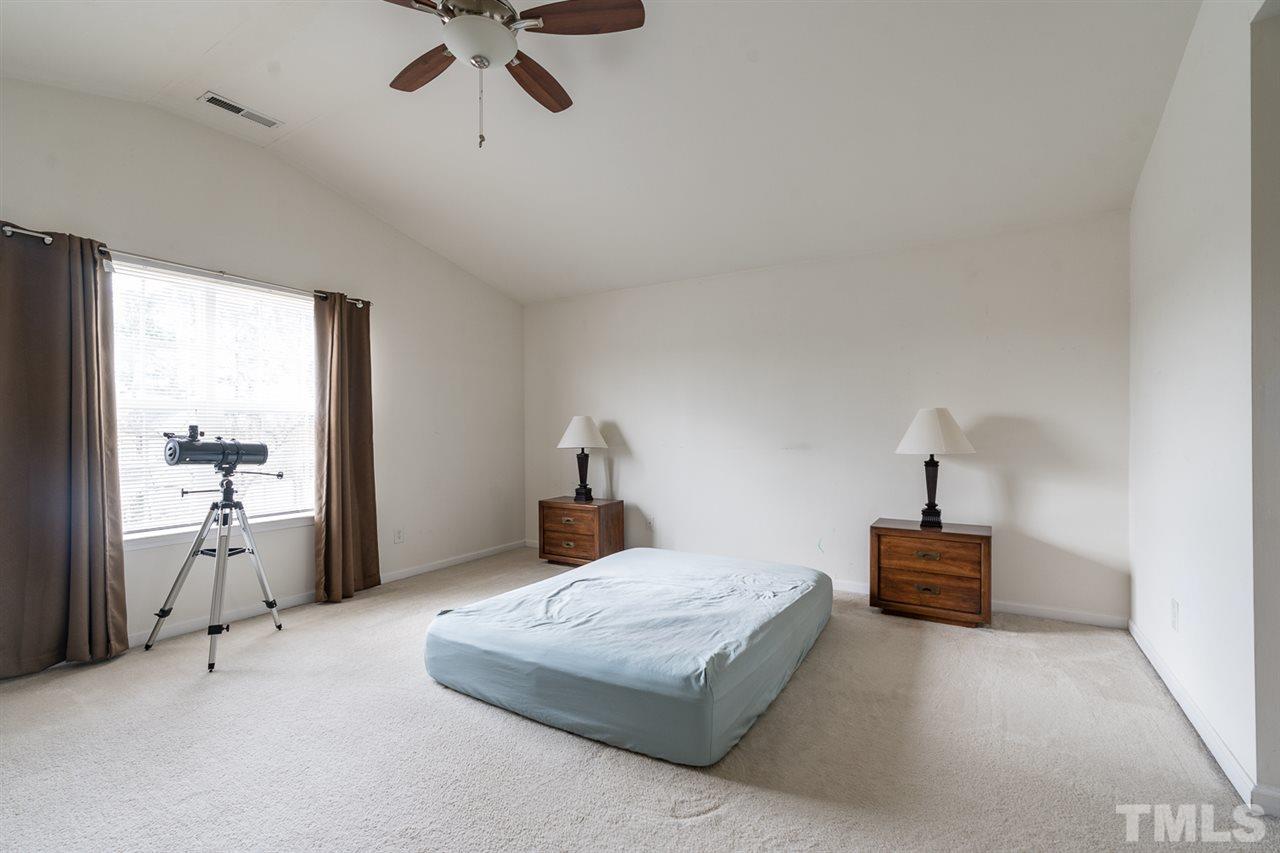 3820 Watkins Ridge Court Raleigh, NC 27616 - Photo 10 of 22 a bedroom with a bed and window
