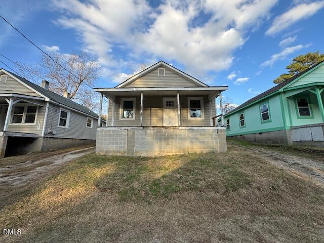 410 Spring Court Henderson, NC 27536 - Photo 2 of 2 a view of a house with a yard