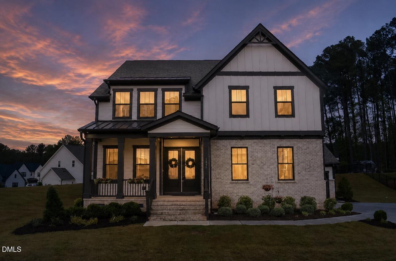 7640 Hasentree Way Wake Forest, NC 27587 - Photo 2 of 40 a front view of a house with a yard