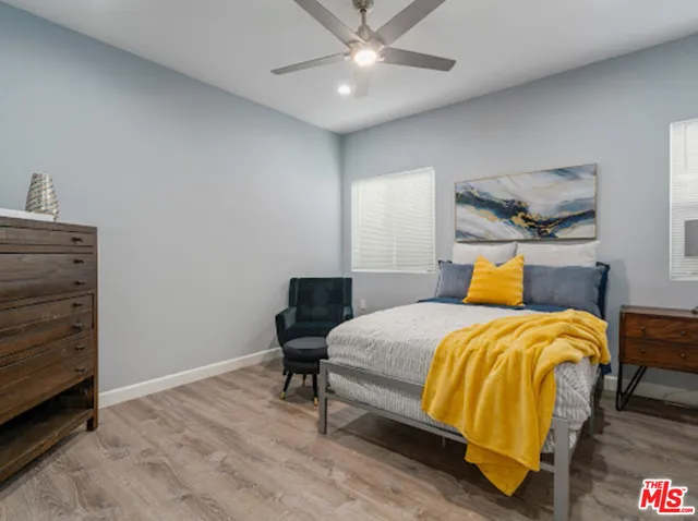 a bedroom with a bed and a television