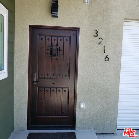 a view of a kitchen from the hallway