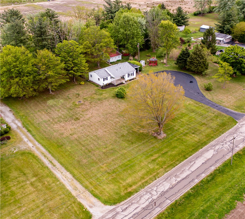 11296 Pansing Road Brookville, OH 45309 - Photo 2 of 53 This charming home features a well-maintained exterior and a large lot with mature trees.