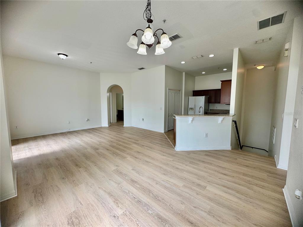 6404 South Goldenrod Road, Unit 2A Orlando, FL 32822 - Photo 39 of 40 a view of empty room with wooden floor and ceiling fan