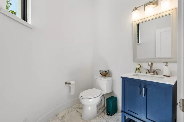 a utility room with sink dryer and washer