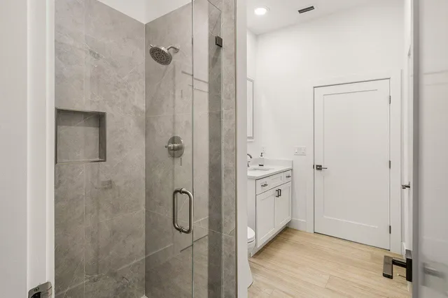 a view of entryway and hall with wooden floor