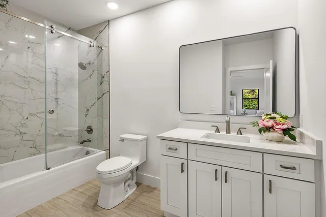 a spacious bedroom with a bed and window