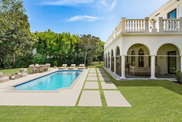 a view of a house with a yard and plants