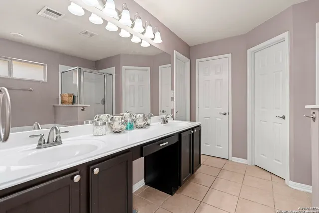 a bathroom with a sink a vanity and a mirror